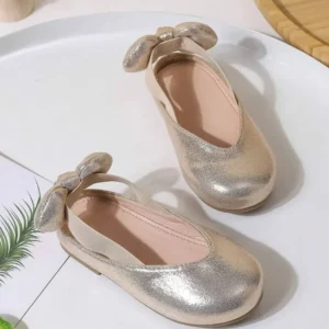 Zapatos planos destalonados dorado metálico con lazo posterior