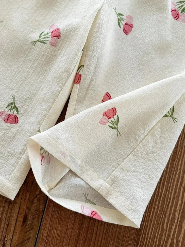 Conjunto de blusa con volantes y pantalón estampado floral