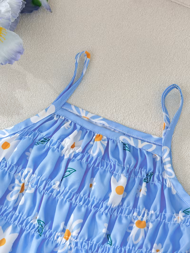Top camisola con goma elástica y pantalón recto estampado margaritas