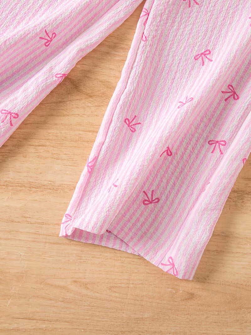 Conjunto 2 piezas veraniego rayado rosado con estampado lazos